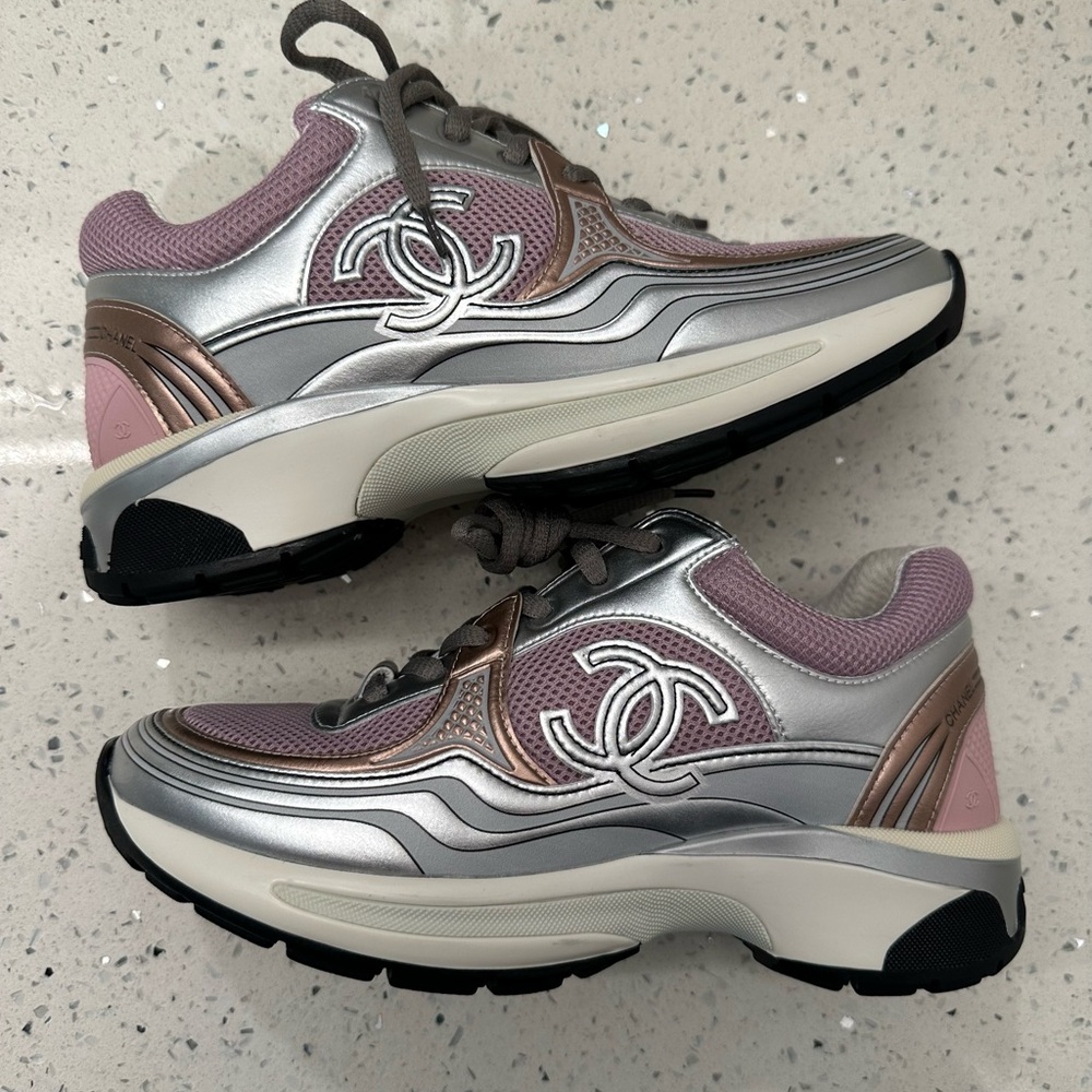 New 38 (7-7.5)Metallic pink and rose gold sneaker.